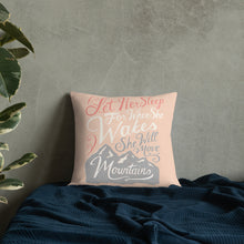 Load image into Gallery viewer, A pink cushion leans against a grey plaster wall on a navy blue bed. The cushion reads &#39;Let her sleep for when she wakes she will move mountains&#39; in a pink, white, and light grey lettering design, with a grey mountain illustration at the bottom.