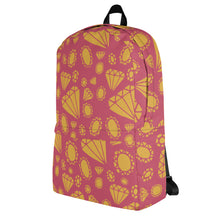 Load image into Gallery viewer, A backpack featured with a white background. The backpack features illustrated gems and diamonds in gold on top off a muted hot pink colored backpack. The straps are black. 