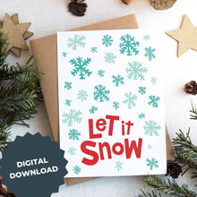 Load image into Gallery viewer, A Christmas card on top of a brown craft paper gift. The card has a white background with the words &quot;let it snow&quot; at the bottom in red. Illustrated snowflakes are on the rest of the card in different shades of blue. The words &quot;digital download&quot; are on top of the image. 