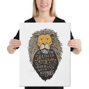 A woman holding a canvas in her hands. The canvas has a white background and features hand drawn illustration of the Chronicles of Narnia lion character Aslan. Inside the illustration there is the quote “At The Sound of Your Roar, Sorrows Will Be No More.”