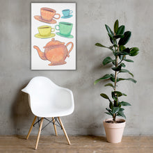 Load image into Gallery viewer, A white canvas with artwork on it hanging above a white chair with a potted plant to the side. The wall is light gray.The artwork is on a white background with four teacups on saucers and one large teapot. The teacups are in muted colors of orange, blue, yellow and green and the teapot is a muted orange. On the teacups, saucers and teapot there is a light flower detail pattern.