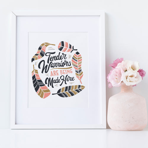 Artwork in a white frame with the with a white matte. The artwork is on a white background with lettering reading 