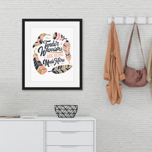 Load image into Gallery viewer, Artwork featured on a wall in a black frame by a shelving unit. The artwork is on white paper and features hand drawn lettering with the words &quot;Tender Warriors Are Being Made Here&quot; The words are in pink, navy and dark mustard yellow. 