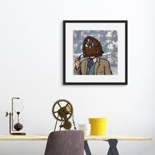 Load image into Gallery viewer, A black frame above a desk featuring an illustration of a vintage radio as a &quot;head&quot; of a person in a suit who is smoking a pipe.