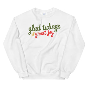 A white sweatshirt on a white background. The sweatshirt has the words "glad tidings of great joy" in red, green and yellow.