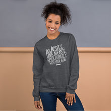 Load image into Gallery viewer, A woman wearing a dark grey sweatshirt with white lettering featuring Do justly, love mercy, walk humbly, with your God, Micah 6:8.