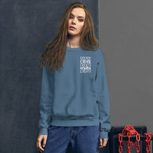 Load image into Gallery viewer, A woman wearing an indigo blue sweatshirt with the word &quot;create, create, create, create, create&quot; in white in a small rectangle on the upper left side.