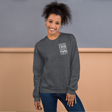 Load image into Gallery viewer, A woman wearing a dark grey sweatshirt with the word &quot;create, create, create, create, create&quot; in white in a small rectangle on the upper left side.