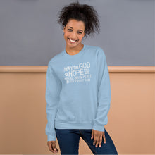 Load image into Gallery viewer, A woman wearing a light blue sweatshirt featuring hand drawn lettering in white with the words &quot;May the God of hope fill you with all joy and peace as you trust him.&quot;