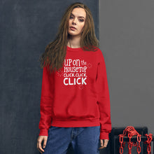 Load image into Gallery viewer, A woman wearing a red sweatshirt featuring hand drawn lettering with the words &quot;Up on the housetop, click, click, click&quot; in white. There are three white stars around the words. 